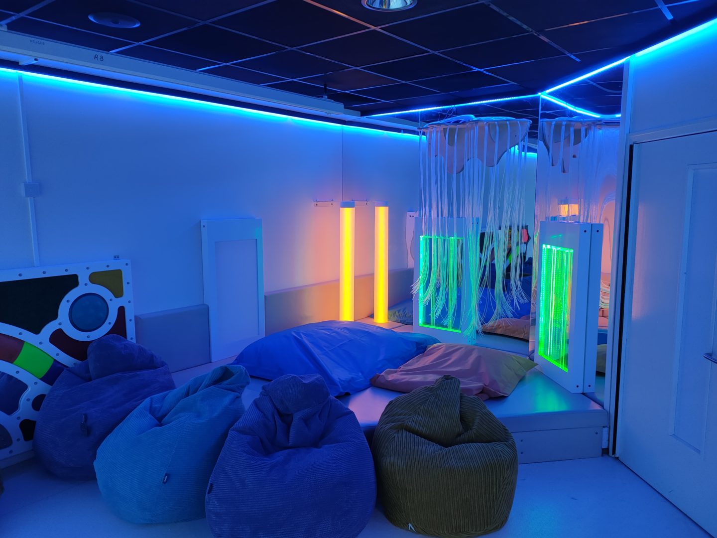 interactive light tube, bubble panels and a tactile panel in a soft padded multi sensory corner