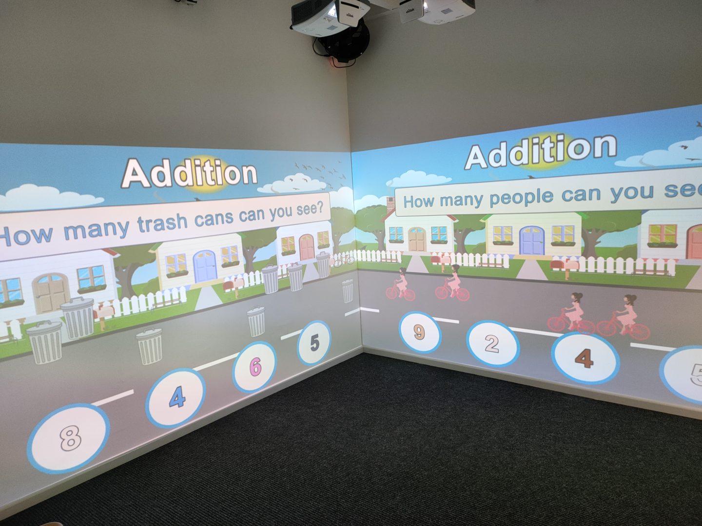 fully interactive immersive room including 2 interactive walls and a range of DMX sensory effect hardware. displaying educational numeracy activities