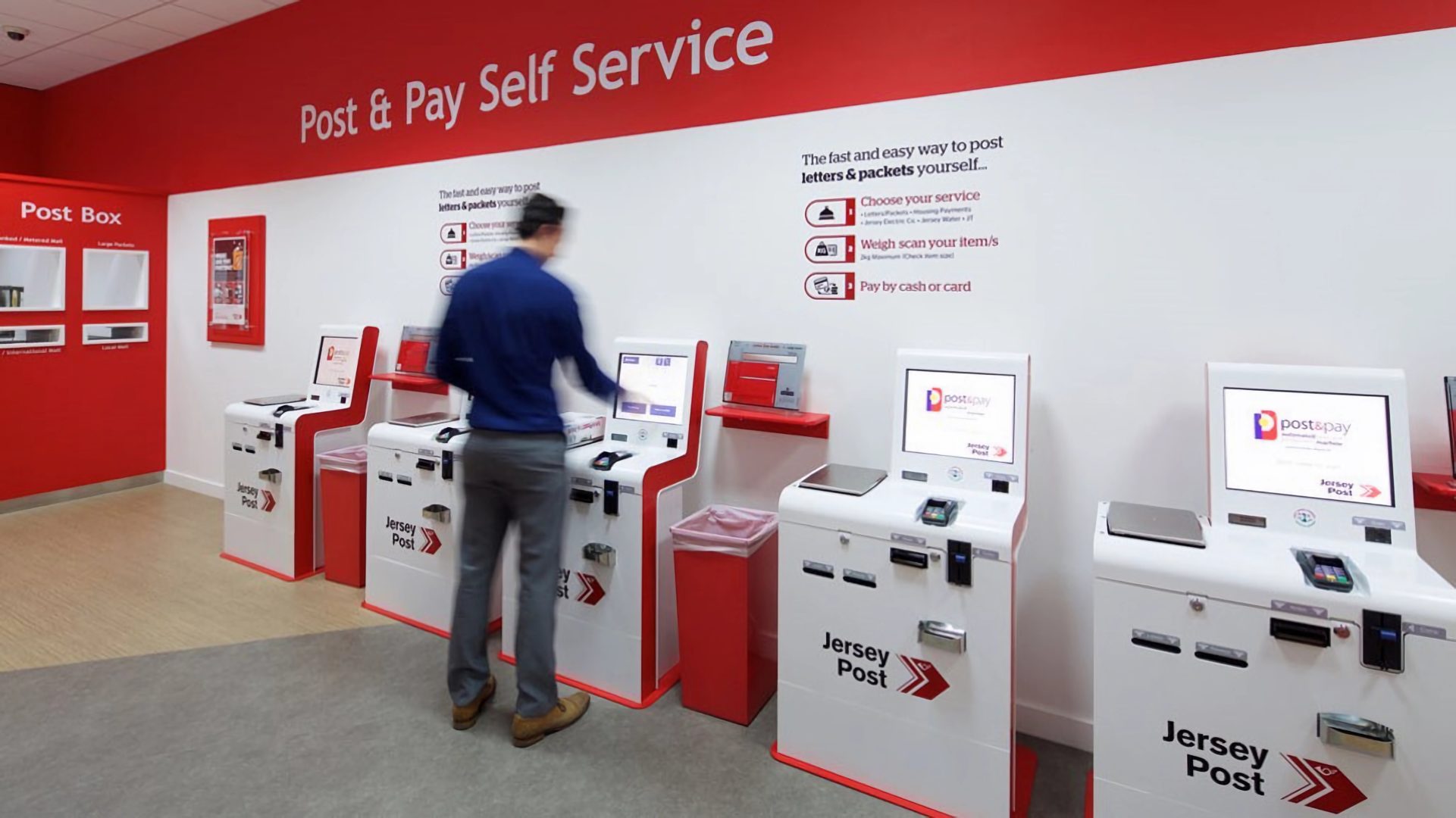 red and white smart postal kiosks with integrated scale allowing bill payments and stamp printing designed for pick up and drop off (PUDO)