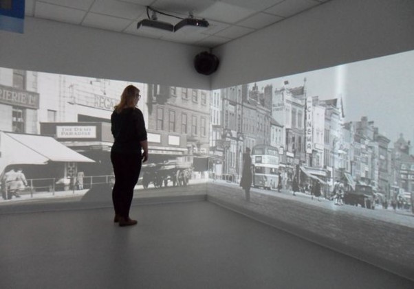 fully interactive immersive room including 4 interactive walls and a range of DMX sensory effect hardware. displaying a historical shopping street to relive forgotten memories