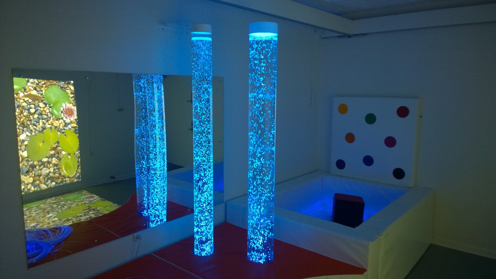 interactive bubble tube in soft padded plinth partnered with a cube controlled RGB ball pit in a snuzelen room