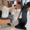 lady sat in the chair using an interactive screen